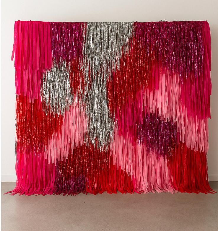 Pink red and silver fringe backdrop wall for party photo booth