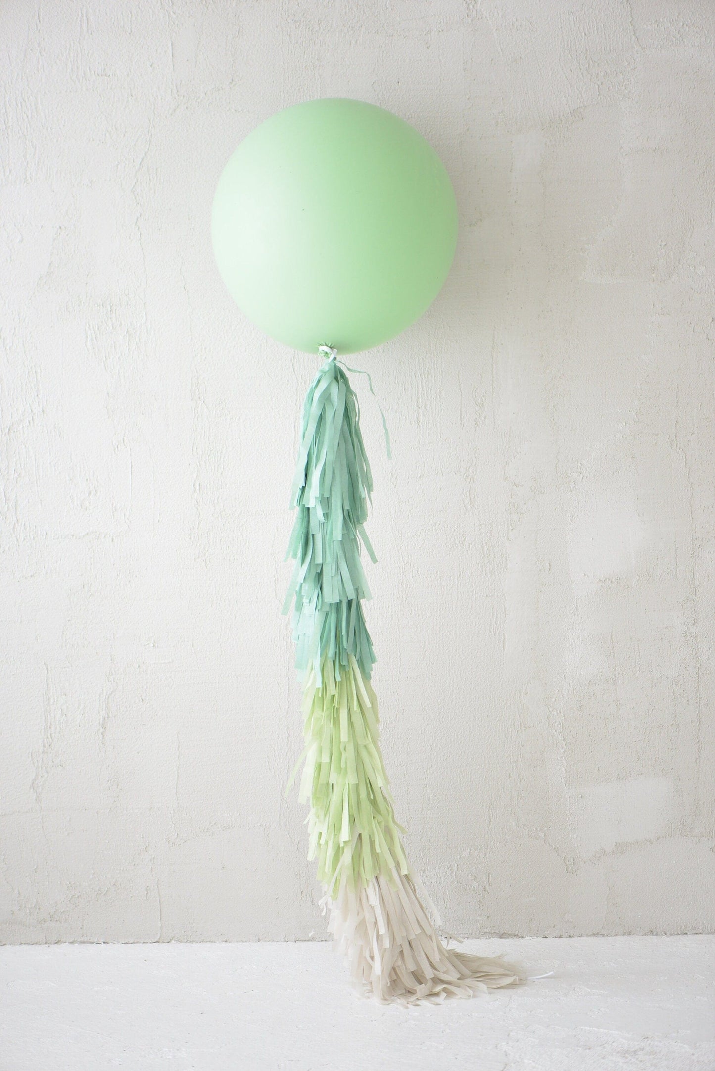 Sage green Giant balloon with green and cream paper fringe tail baby shower, wedding, birthday party balloon decorations paper tassel tail