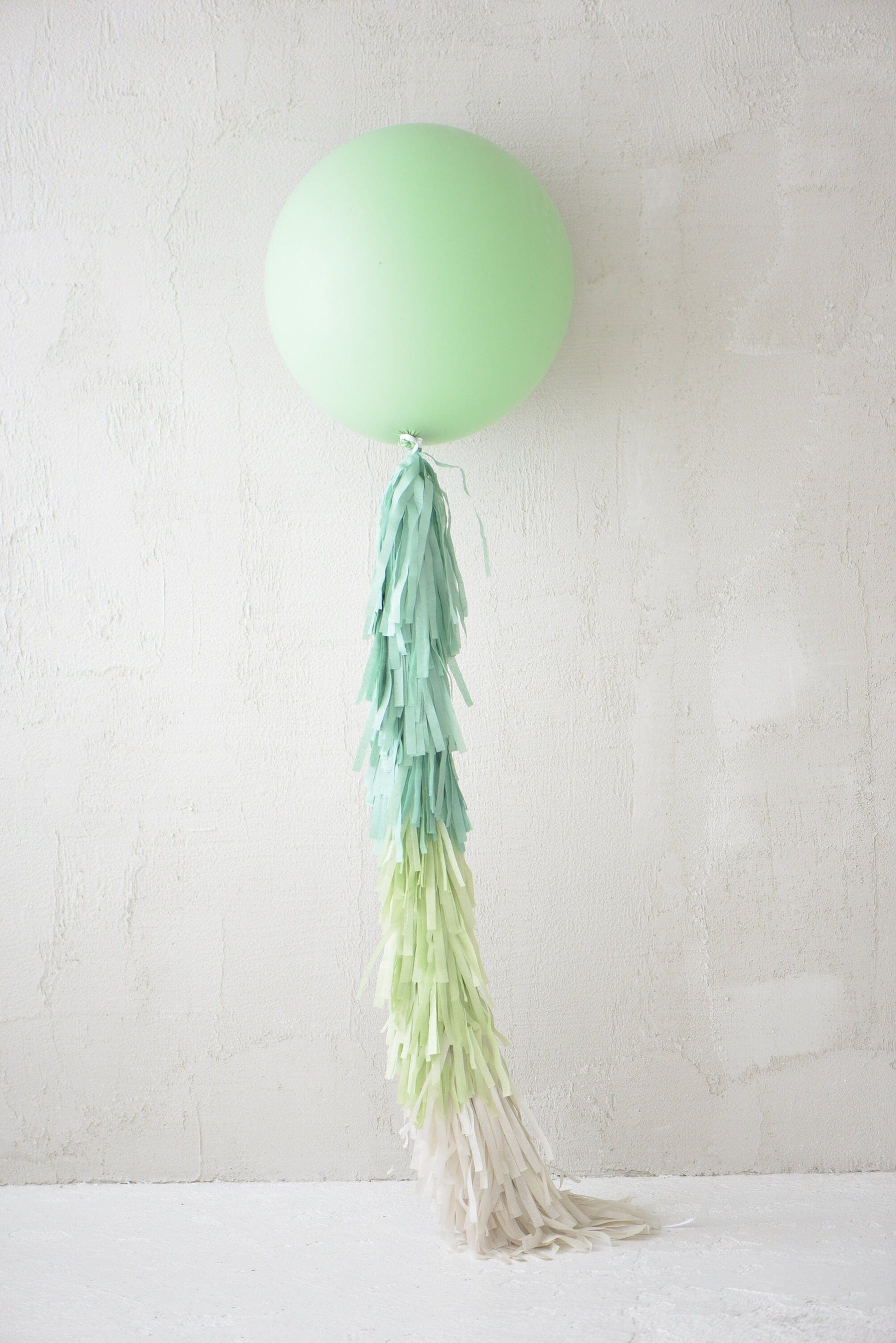 Sage green Giant balloon with green and cream paper fringe tail baby shower, wedding, birthday party balloon decorations paper tassel tail