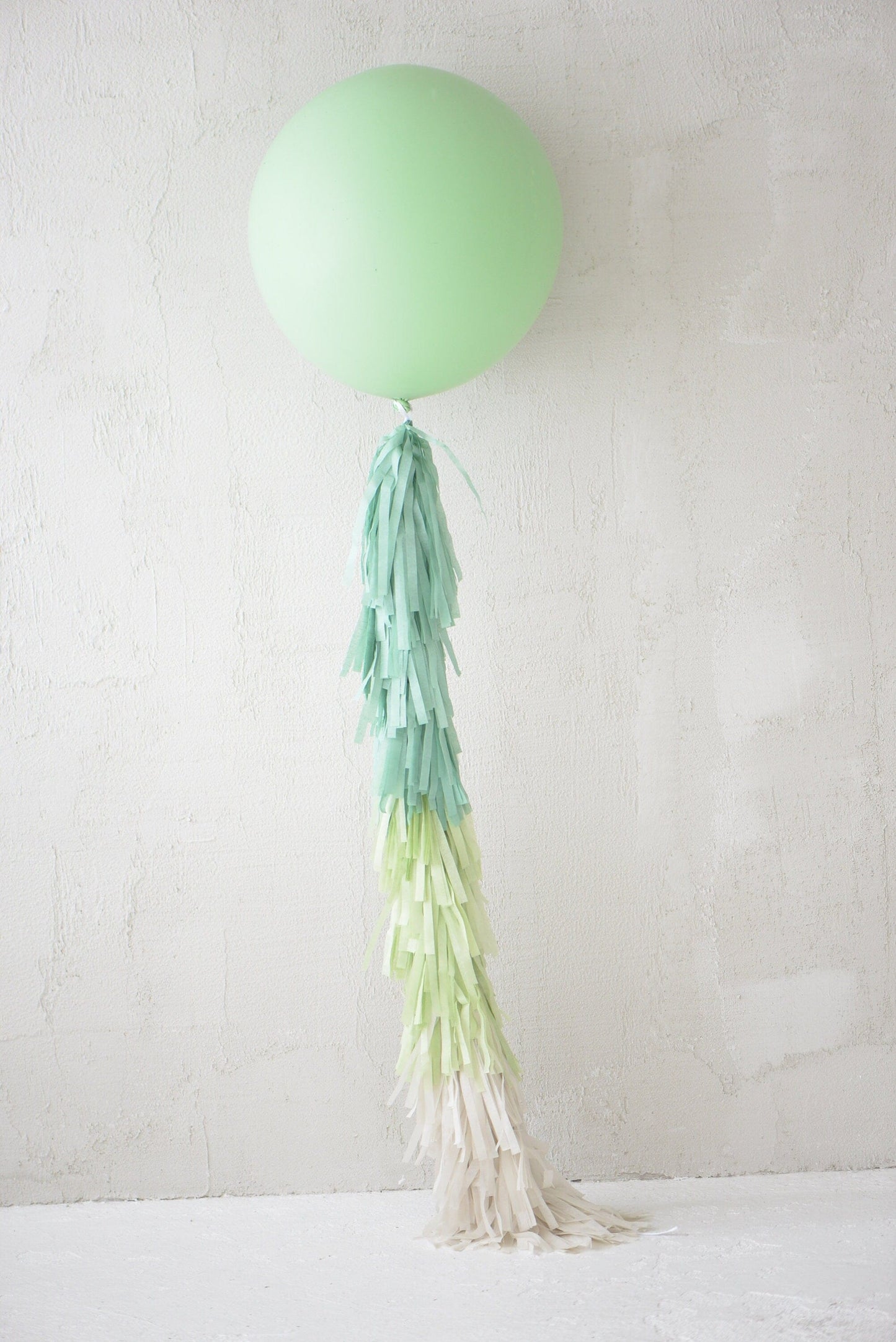 Sage green Giant balloon with green and cream paper fringe tail baby shower, wedding, birthday party balloon decorations paper tassel tail
