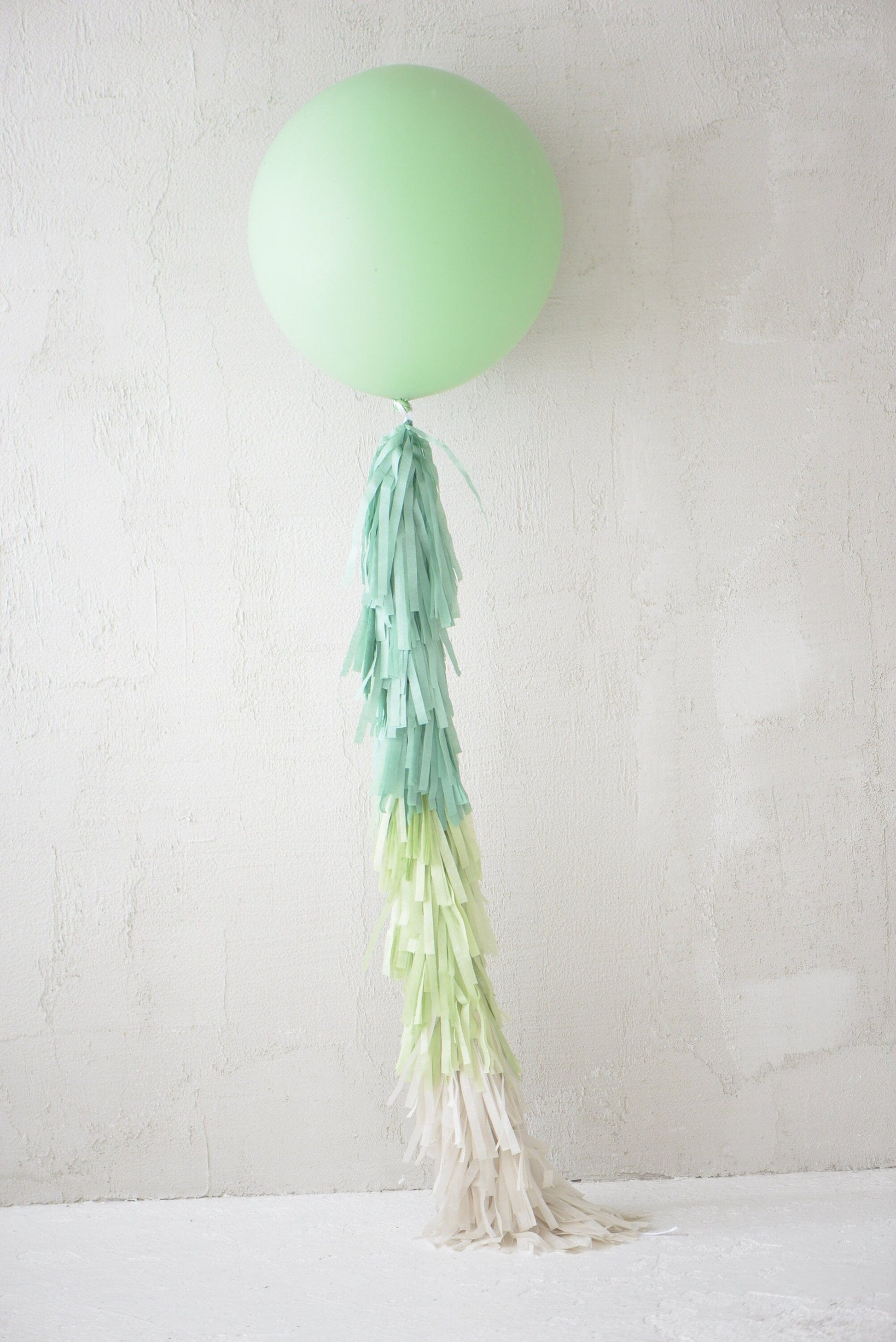 Sage green Giant balloon with green and cream paper fringe tail baby shower, wedding, birthday party balloon decorations paper tassel tail