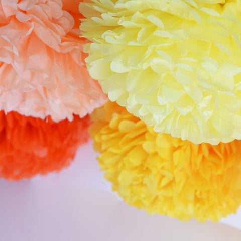 Yellow and orange paper pom poms party decorations set various quantities
