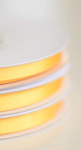 Yellow double sided satin ribbon roll