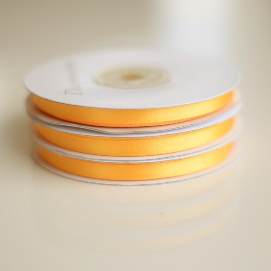 Yellow double sided satin ribbon roll